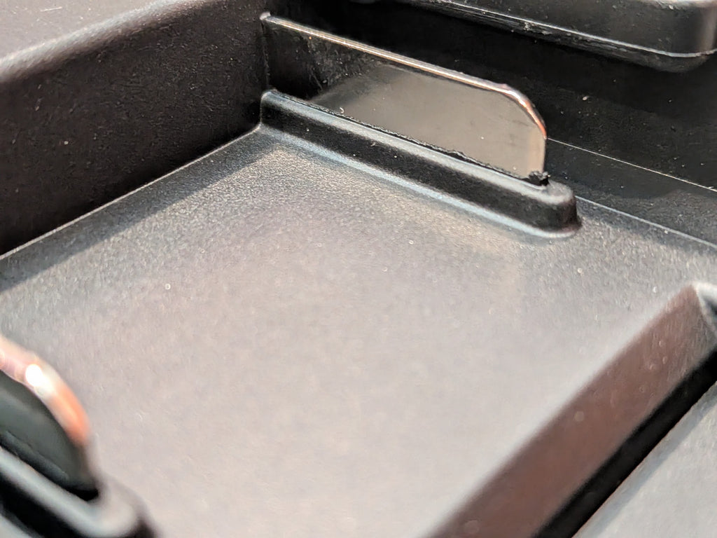 Makita 18V LXT to Bosch 18V GBA (Blue) battery adapter - close-up of a copper contact blade in the channel