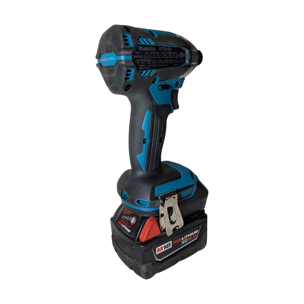 Milwaukee M18 to Makita 18V LXT battery adapter - installed on a Makita impact driver, rear view with the belt clip