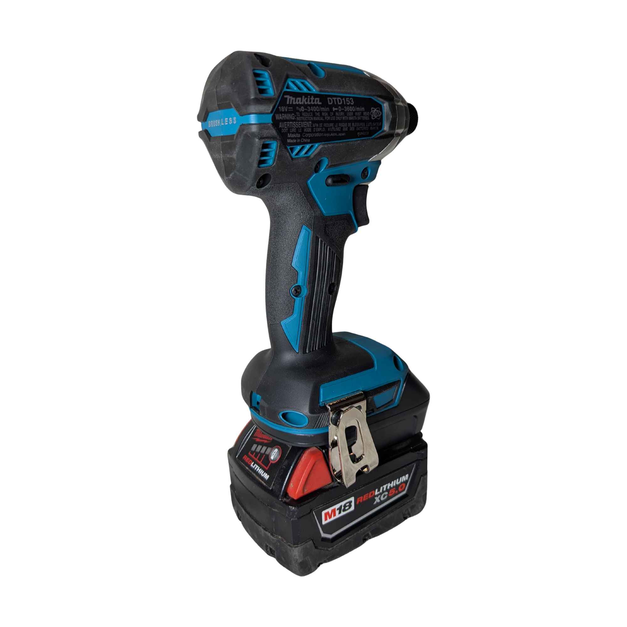 Milwaukee M18 to Makita 18V LXT battery adapter - installed on a Makita impact driver, rear view with the belt clip
