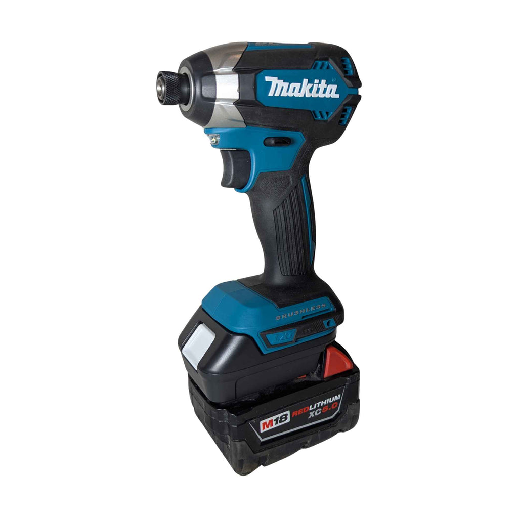Milwaukee M18 to Makita 18V LXT battery adapter - installed on a Makita impact driver with the Milwaukee battery attached