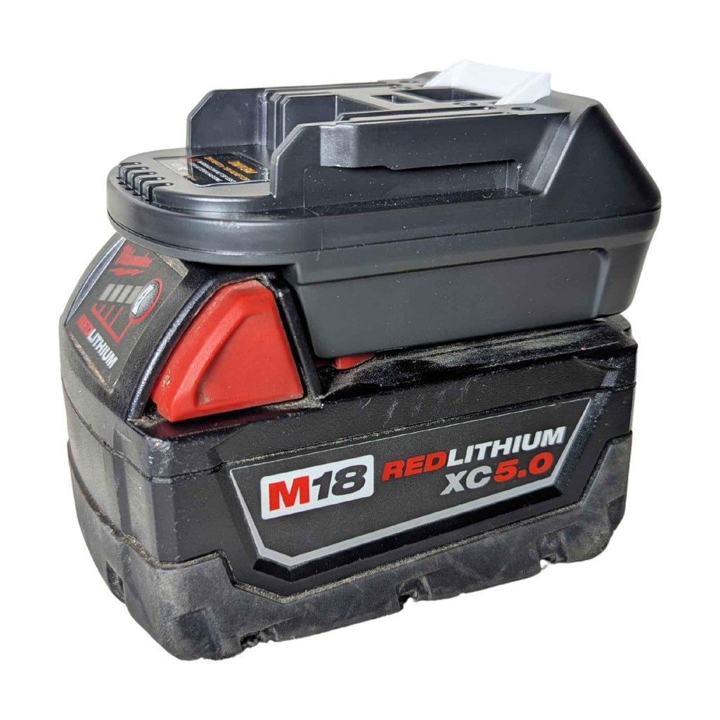 Milwaukee M18 to Makita 18V LXT battery adapter - fitted to the Milwaukee M18 battery, fuel gauge and release catch in view