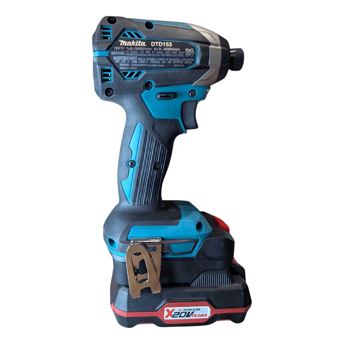 Parkside X20V to Makita 18V LXT battery adapter - installed on an impact driver, three-quarter rear view, battery pack below